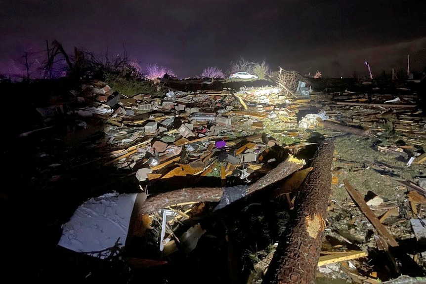 A view at noght of buildings damaged by the tornados.