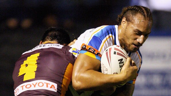 Gold Coast Titan Sam Tagataese tackled by two Broncos players