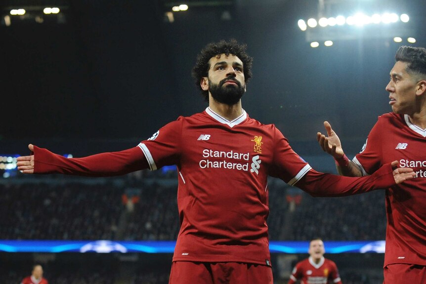 Liverpool's Mo Salah spreads his arms wide after scoring key goal