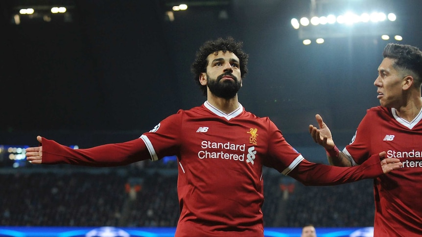 Liverpool's Mo Salah spreads his arms wide after scoring key goal