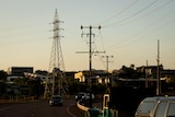Powerlines seen at dusk in Darwin.