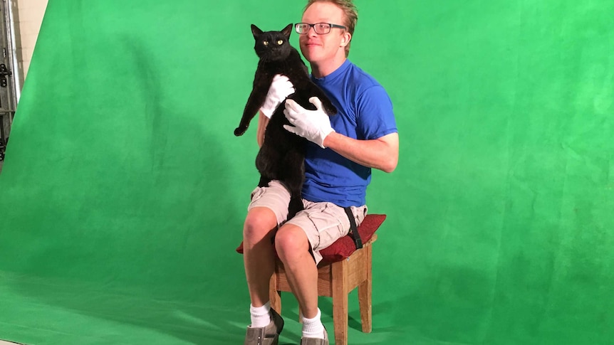 Adelaide filmmaker James Kurtze with his cat.