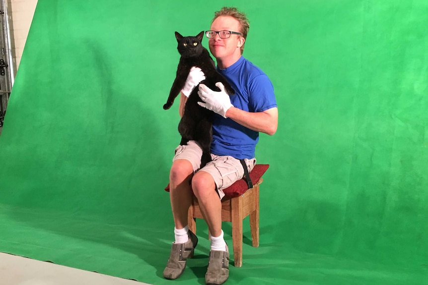 Adelaide filmmaker James Kurtze with his cat.