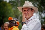 NT Chief Minister Michael Gunner wears a hat and looks at the camera