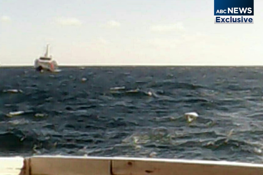 A Customs boat approaches an asylum seeker boat