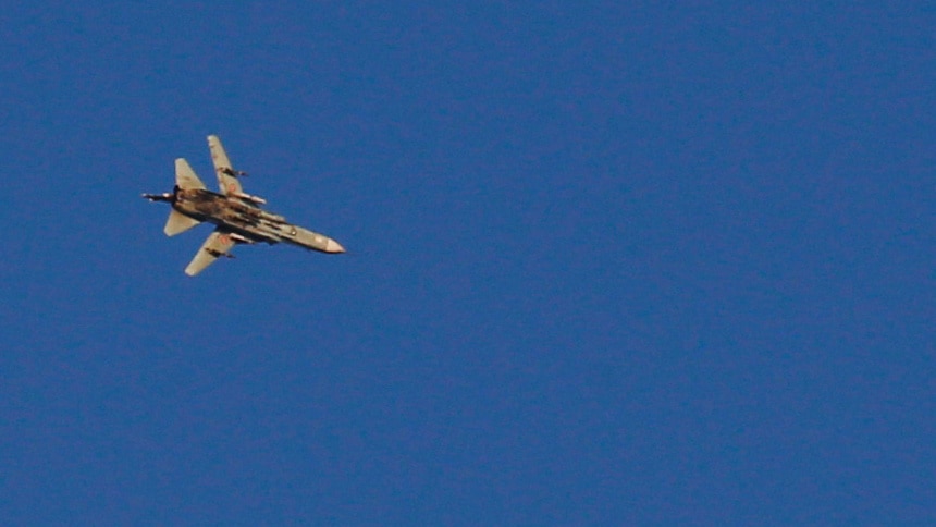 A war jet flies above Syria