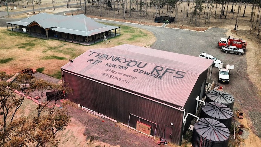 an aerial shot of a thank you rfs message on a tin roof