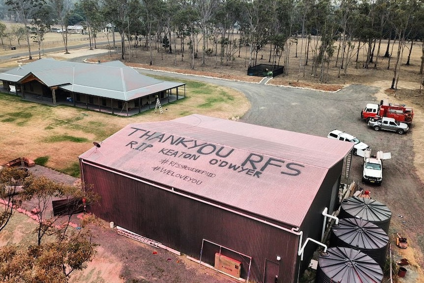 an aerial shot of a thank you rfs message on a tin roof