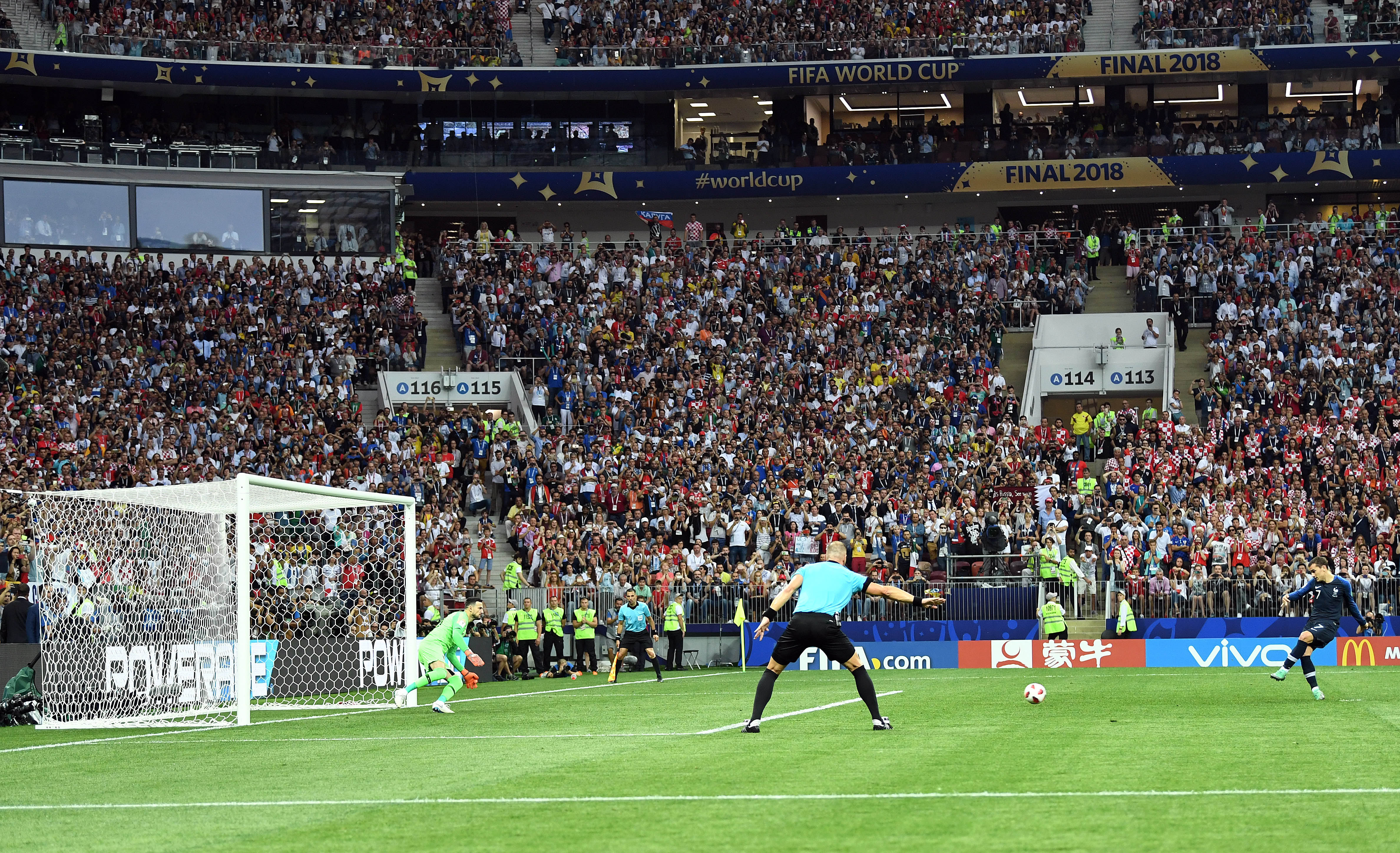 France's Antoine Griezemann makes a kick from the designated penalty spot.