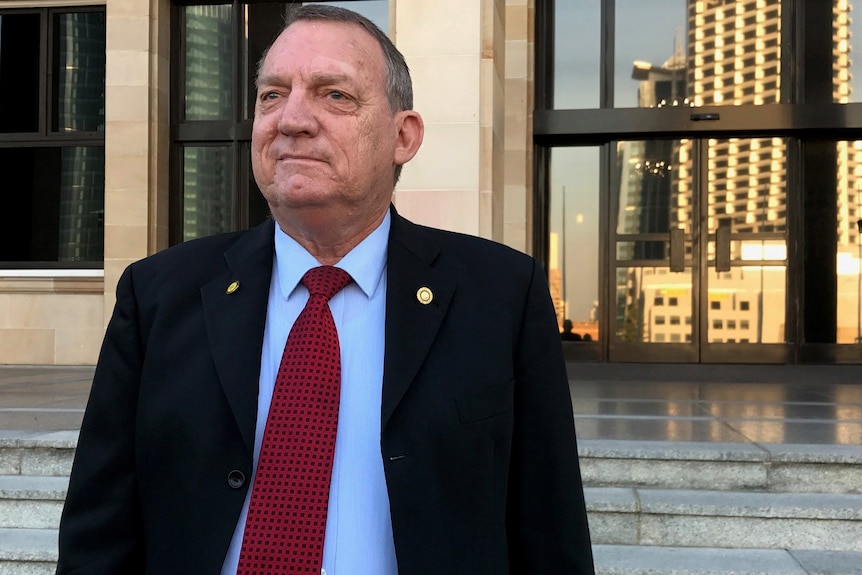 Graham Kierath standing in front of the WA Parliament.