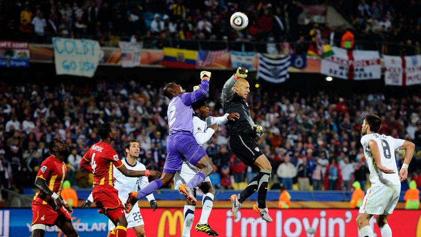 USA threw everything at Ghana late into extra time as 'keeper Tim Howard (R) desperately contested a string of corners.