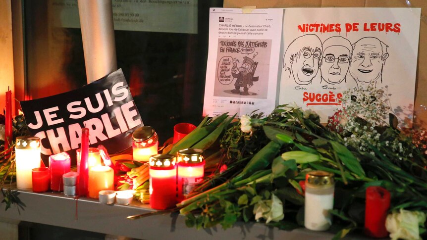 vigil Paris France Charlie Hebdo tribute candles