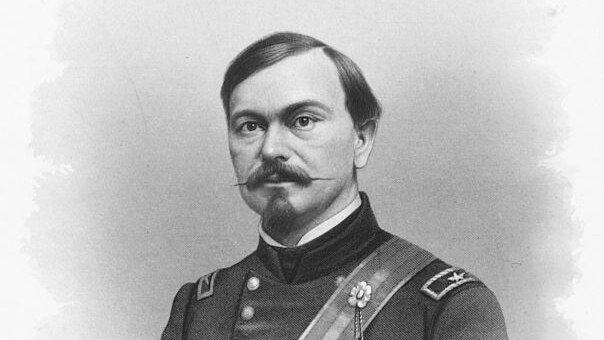 formal old black and white portrait of man with moustache wearing a uniform