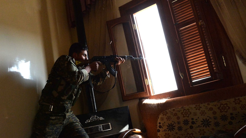 Syrian rebel takes aim