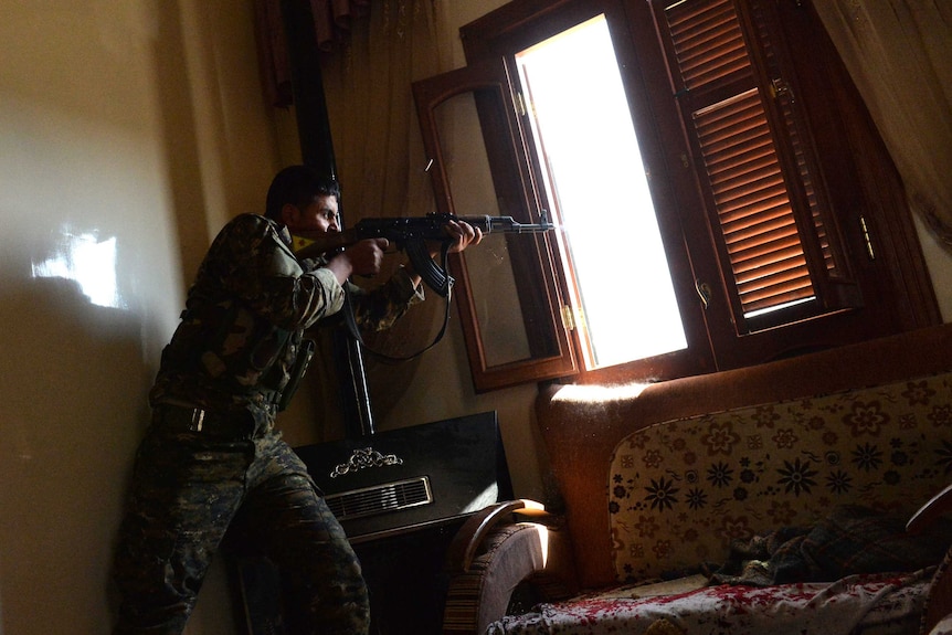 Syrian rebel takes aim