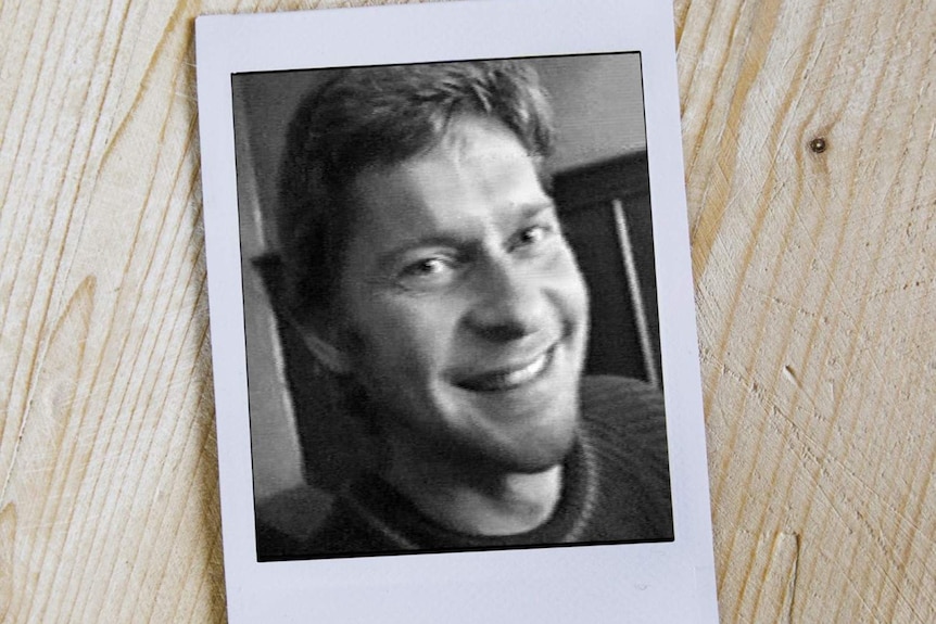 A black and white polaroid of a young man