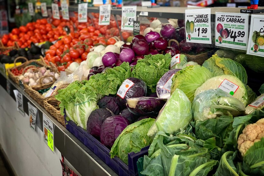 Fruit and vegetables on display at a supermarket.