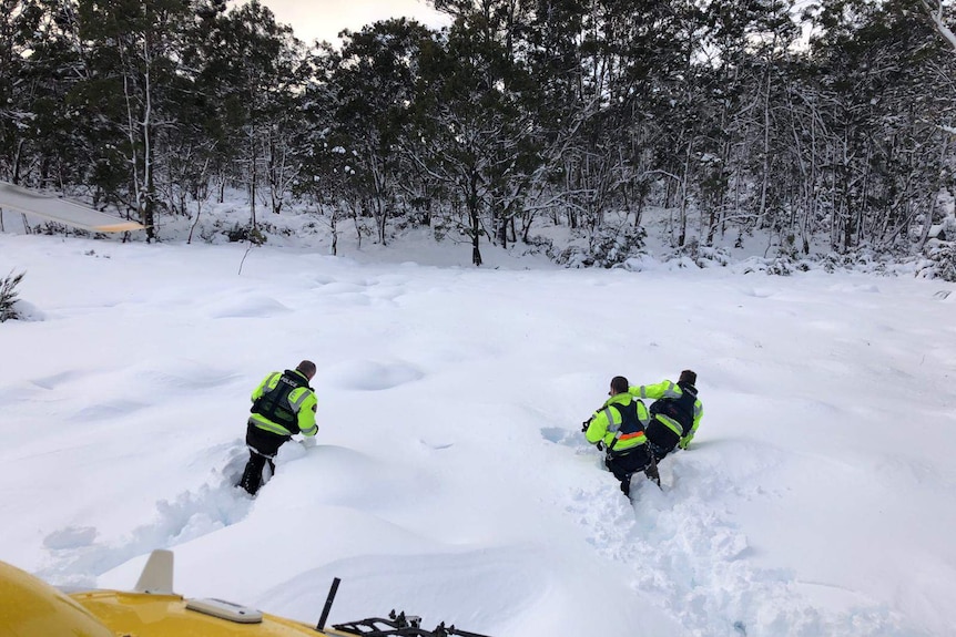 Police rescue team walks through snow in Lake St Clair area