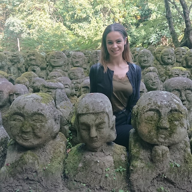 Australian Rina Laino among Japanese statues.