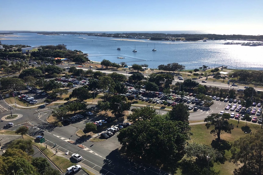 Aerial shot of a large car park which is part of Carey and Queens Park, which adjoins along the Gold Coast highway.
