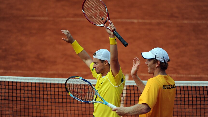 Lleyton Hewitt and Chris Guccione (R) win the doubles in Australia's Davis Cup tie with Germany.