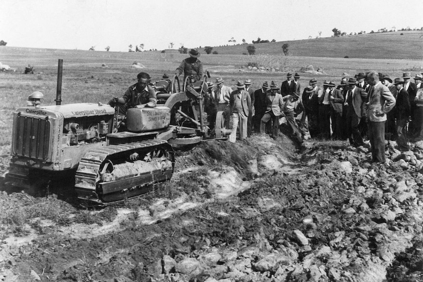 An early photograph of a bull dozer being used for conservation work.