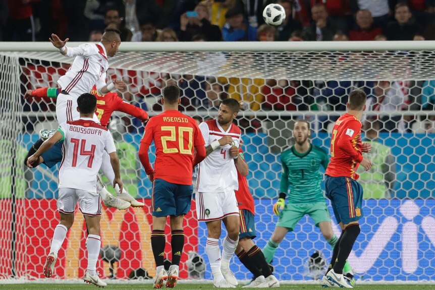 Morocco's Youssef En Nesyri, top left, heads the ball to score his side's second goal