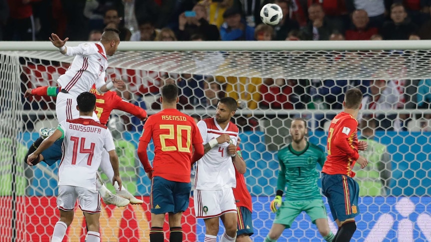 Morocco's Youssef En Nesyri, top left, heads the ball to score his side's second goal