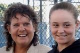 A young Ashleigh Barty smiles with Evonne Goolagong-Cawley