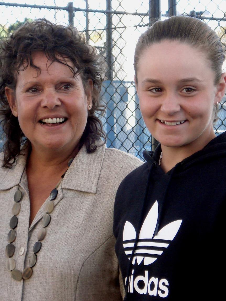 A young Ashleigh Barty smiles with Evonne Goolagong-Cawley