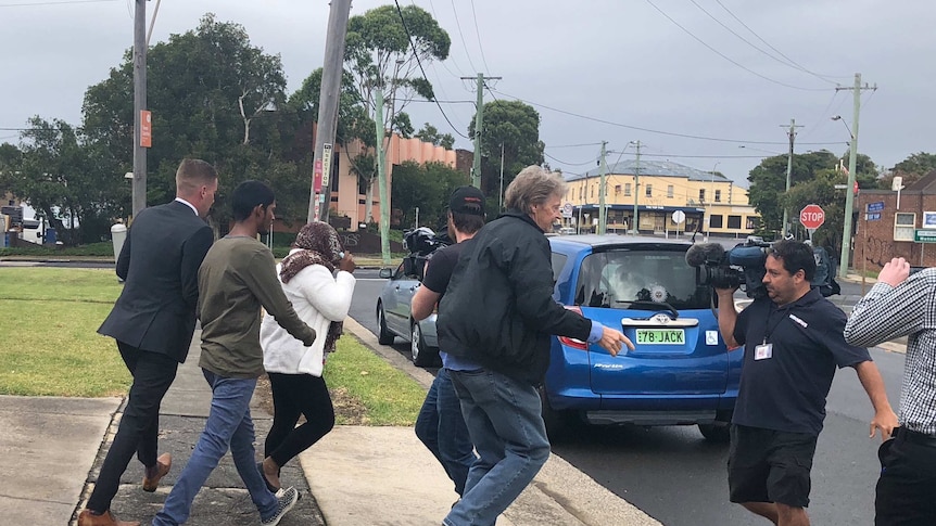 48-year-old formed aged care worker, Shakuntala Mudliar, leaves Port Kembla Local Court with her supporters