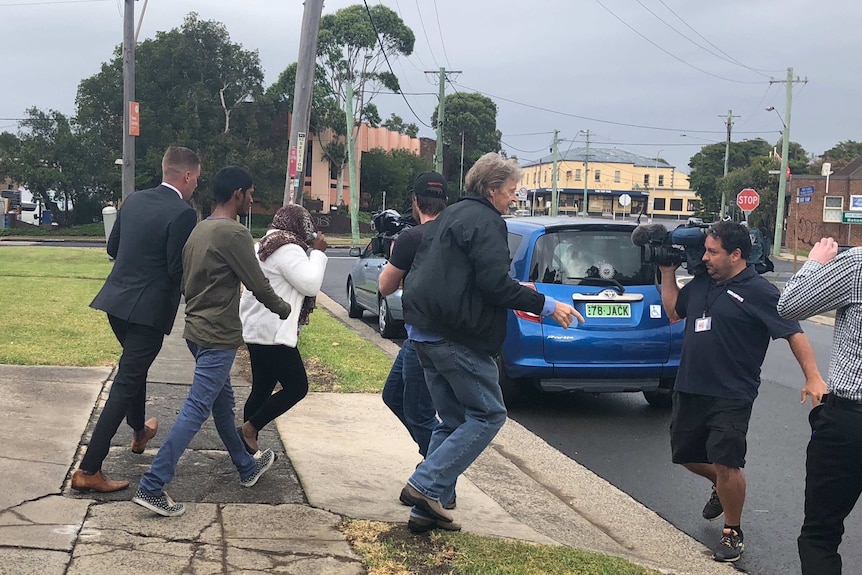 48-year-old formed aged care worker, Shakuntala Mudliar, leaves Port Kembla Local Court with her supporters