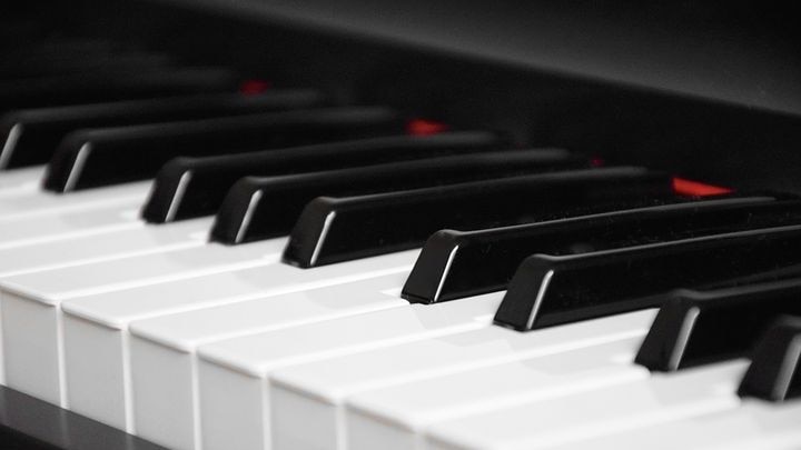 The black and white keys of a piano