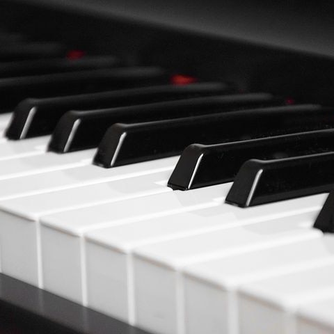 The black and white keys of a piano