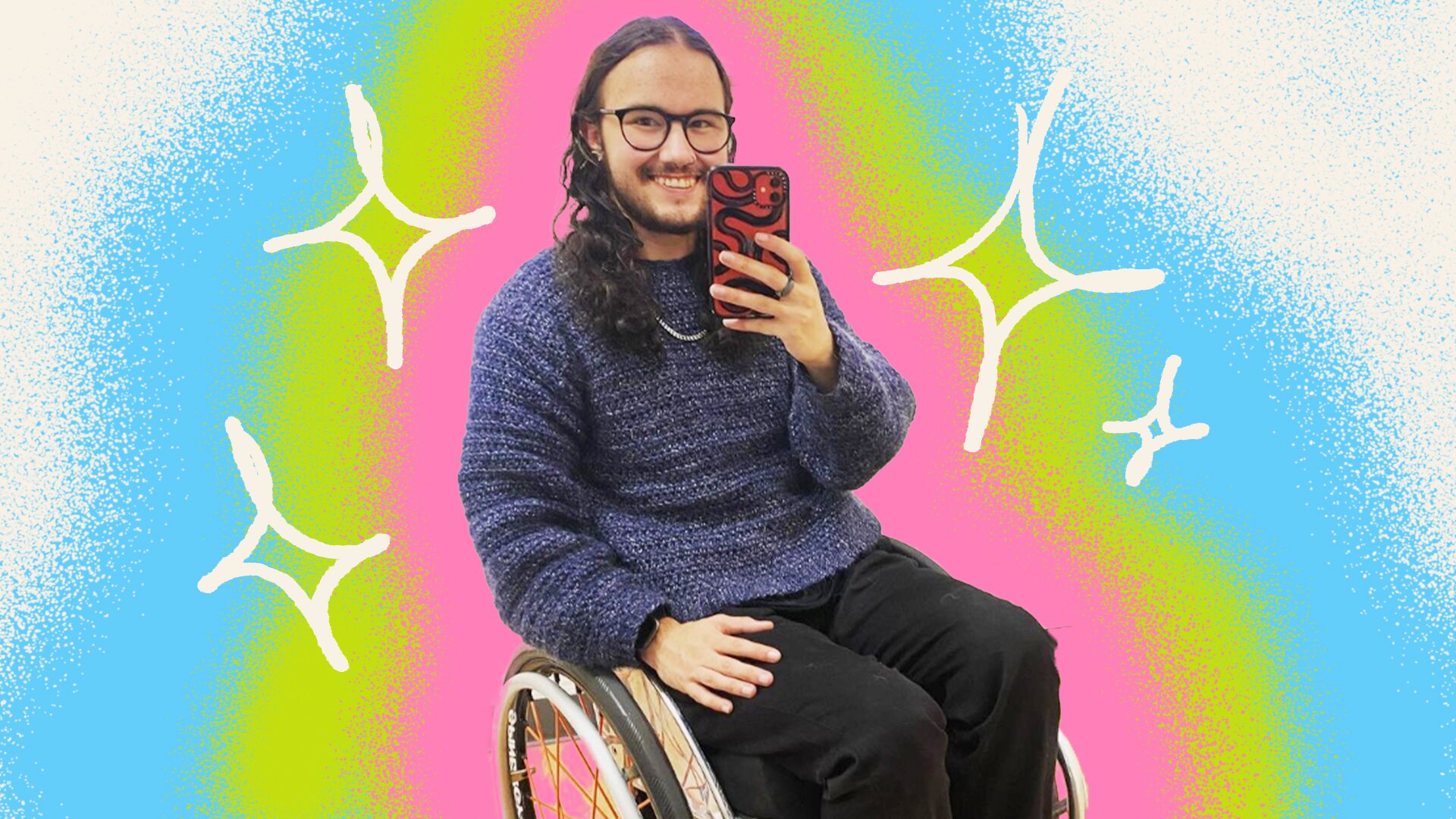Evan Johnson takes a selfie, smiling and sitting in a wheelchair, with blue, green and pink brushstrokes in background. 