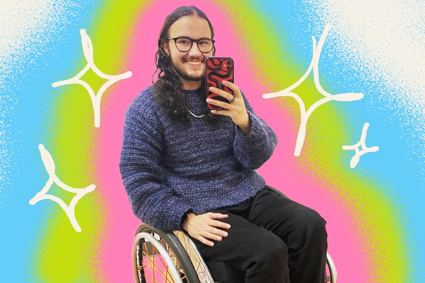 Evan Johnson takes a selfie, smiling and sitting in a wheelchair, with blue, green and pink brushstrokes in background. 