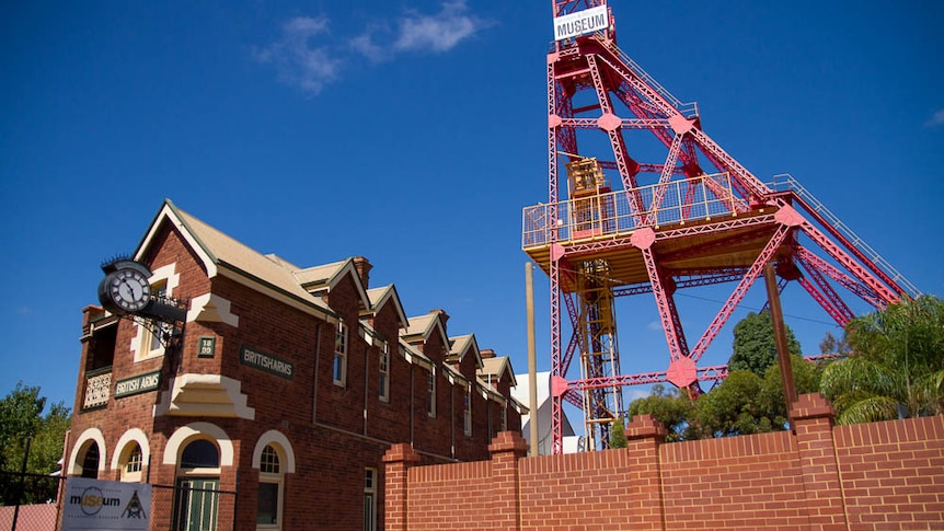 Front of the WA Museum in Kalgoorlie-Boulder showing mine headframe and old pub.