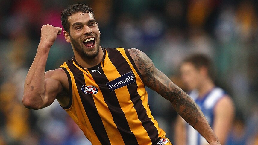 Lance Franklin celebrates another goal in Hawthorn's demolition of North Melbourne at York Park.