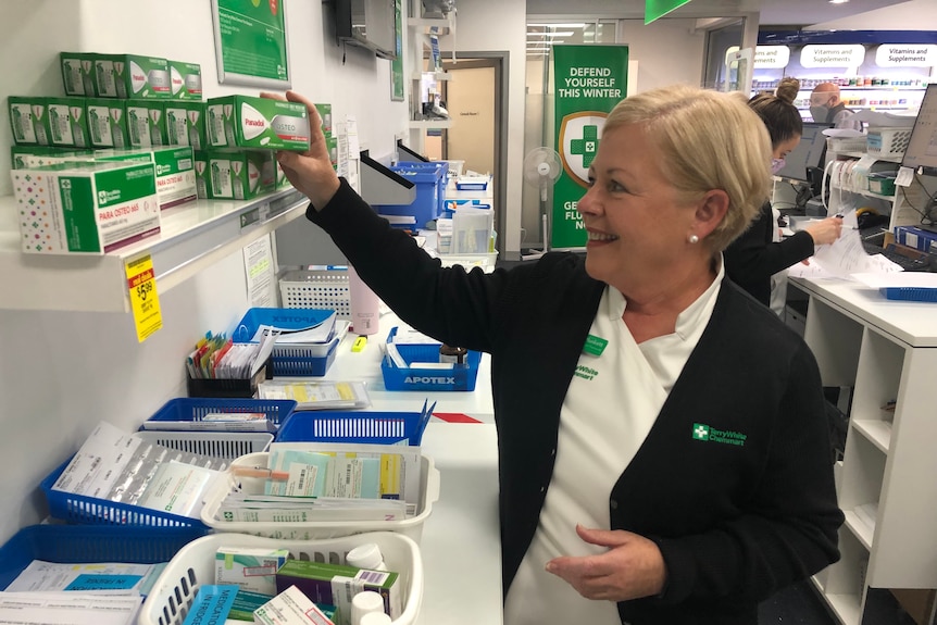 Port Macquarie pharmacist Judy Plunkett is sorting out some medication in a pharmacist