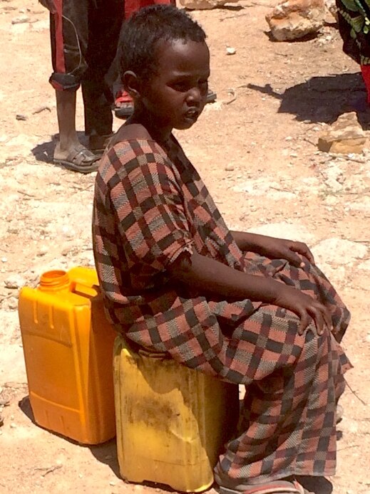 Children waiting for their turn to get water from a salty water well in Somaliland.