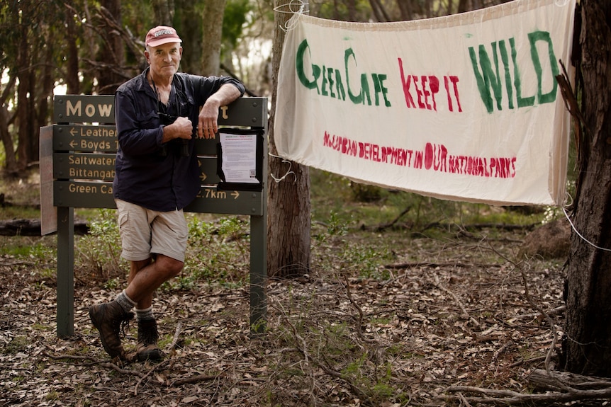 A protest banner that reads "Green Cape, Keep It Wild"