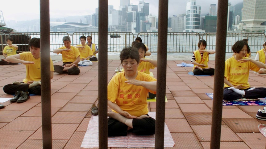 Falun Gong followers meditate in Hong Kong.