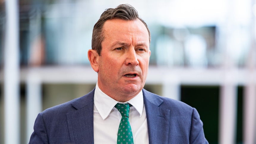 WA Premier Mark McGowan, wearing a dark suit and sporting a neat haircut, speaks to the media.