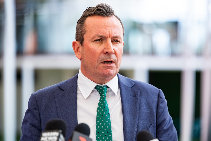 WA Premier Mark McGowan, wearing a dark suit and sporting a neat haircut, speaks to the media.