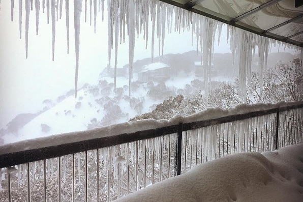 Snow on a balcony.