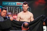 A sheet is used to cover Jeff Horn, who weighed in naked
