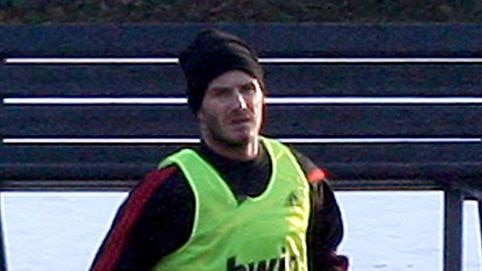AC Milan midfielder David Beckham watches the ball during a training session