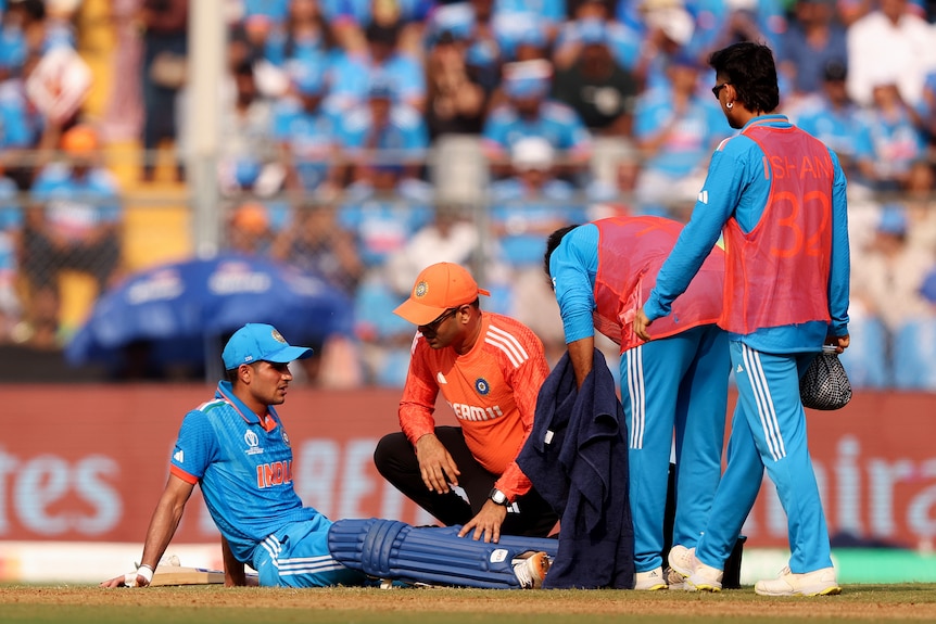 Shubman Gill sits on the ground