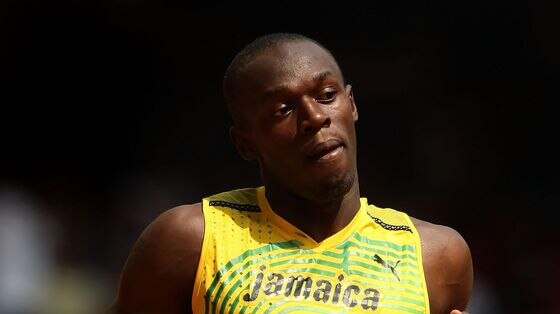 See you in London: Bolt says he will be back in 2012 to defend his titles.
