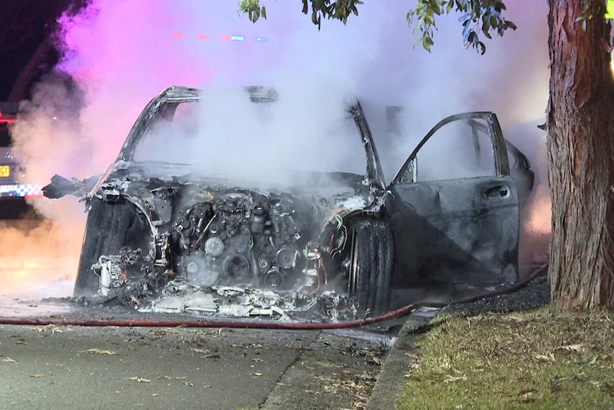 Smoke coming out of a car after it was caught on fire